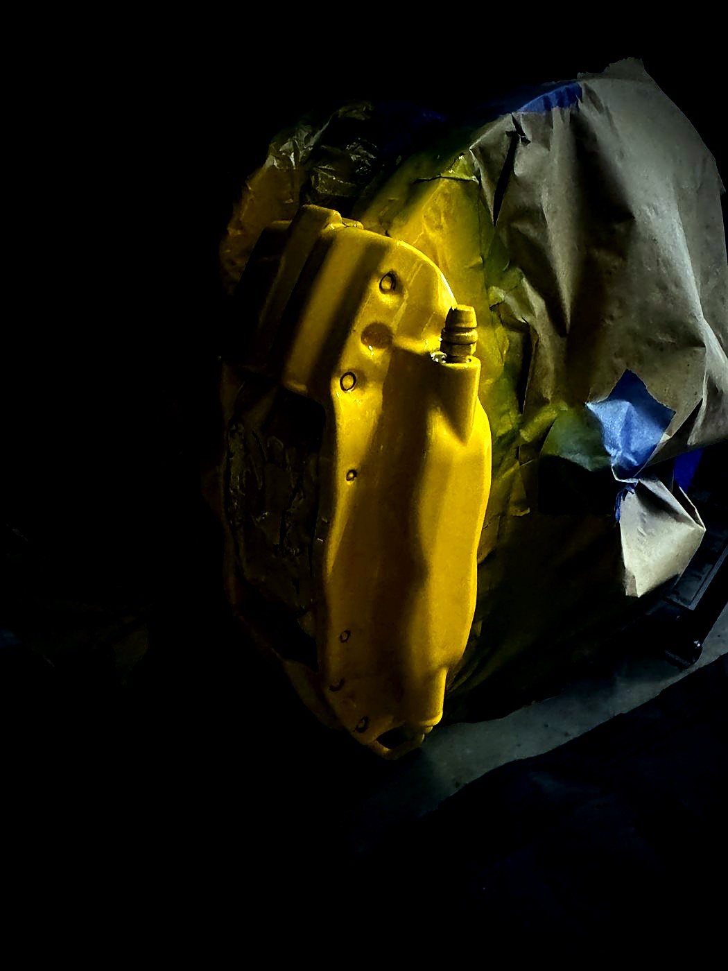 Yellow caliper masked and freshly painted
