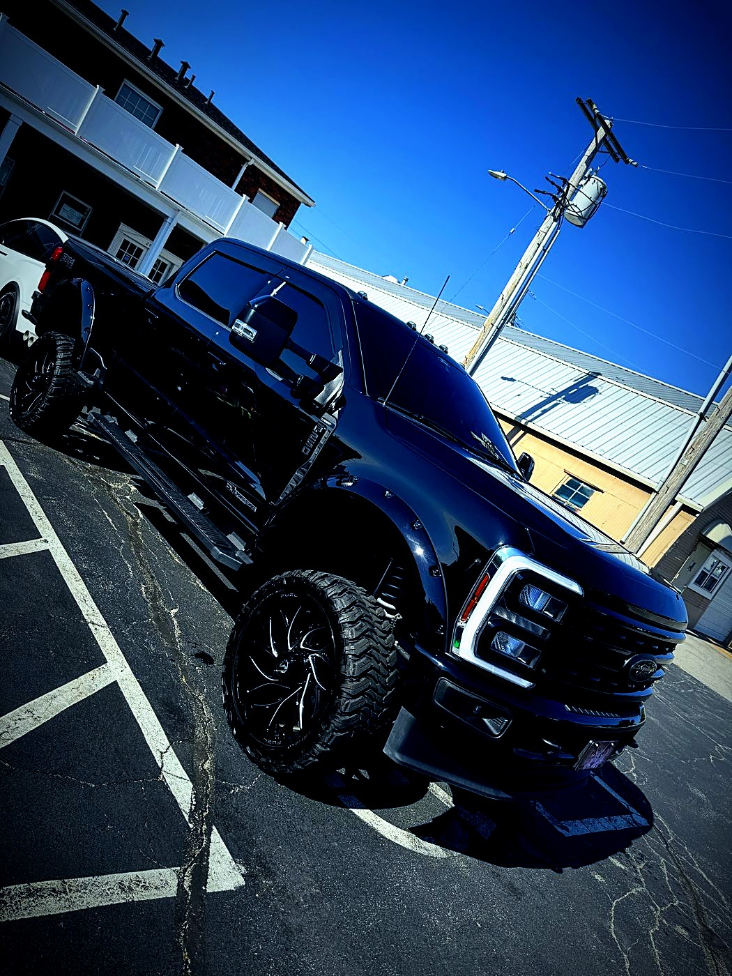 Lifted black Ford Super Duty, freshly detailed