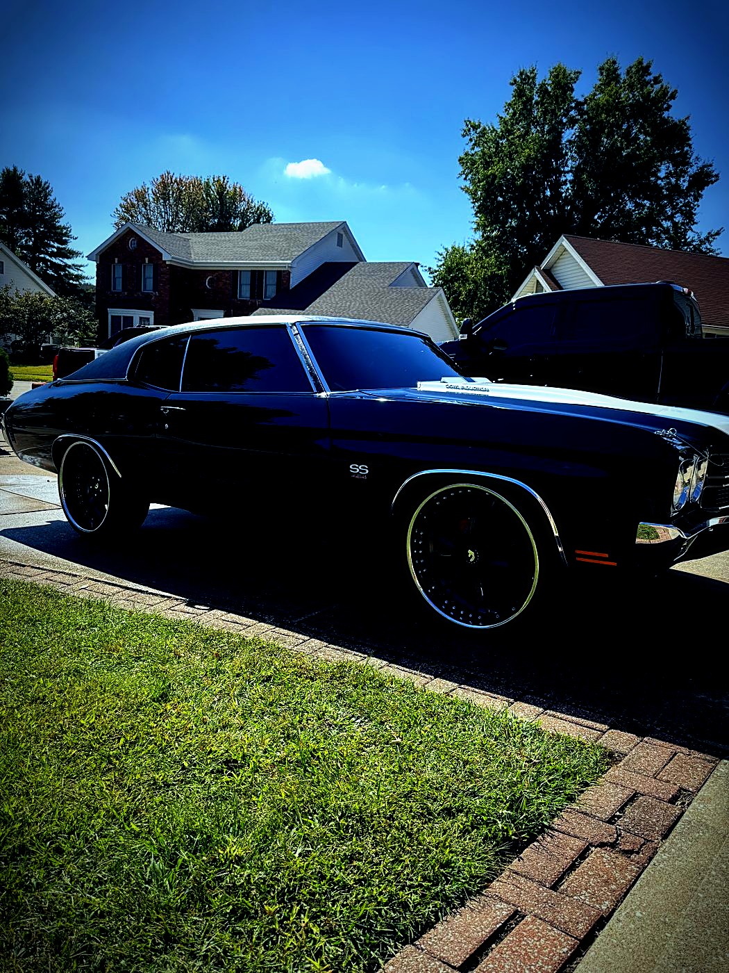 Classic black Chevelle on custom wheels after a detail