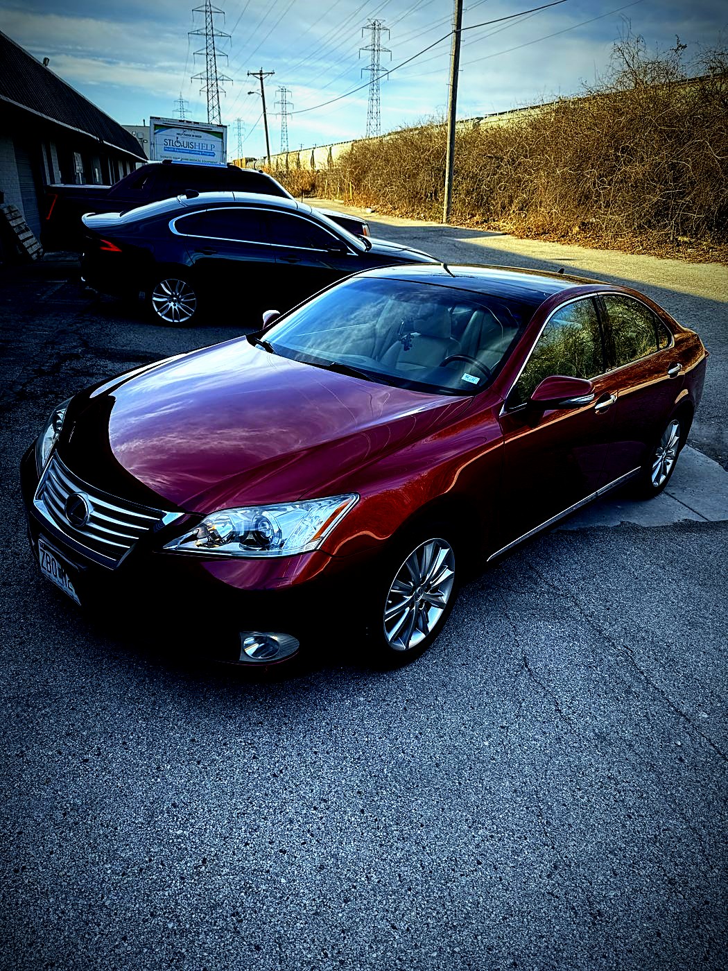Red Lexus sedan after a wash and shine