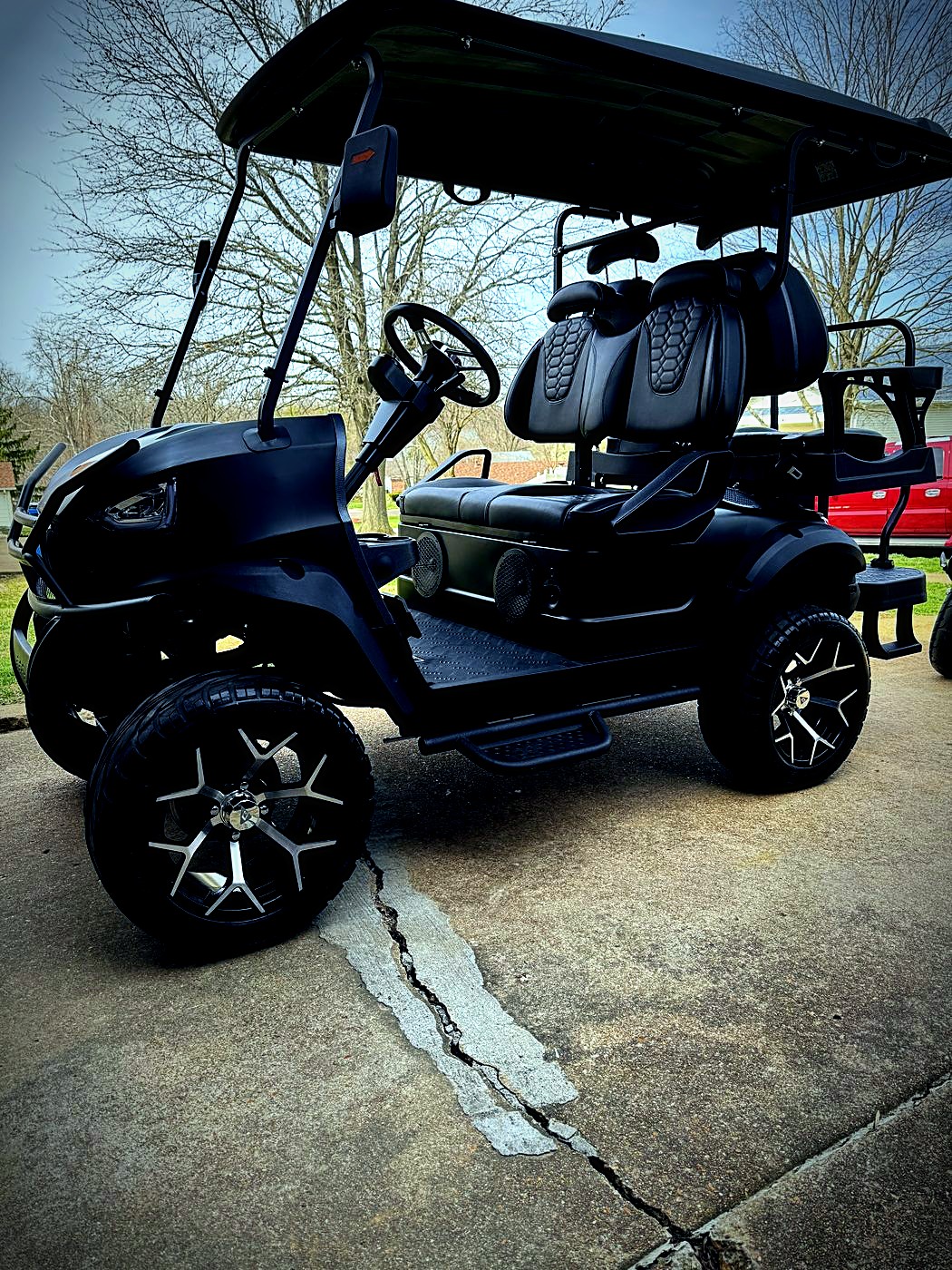 Black lifted golf cart detailed
