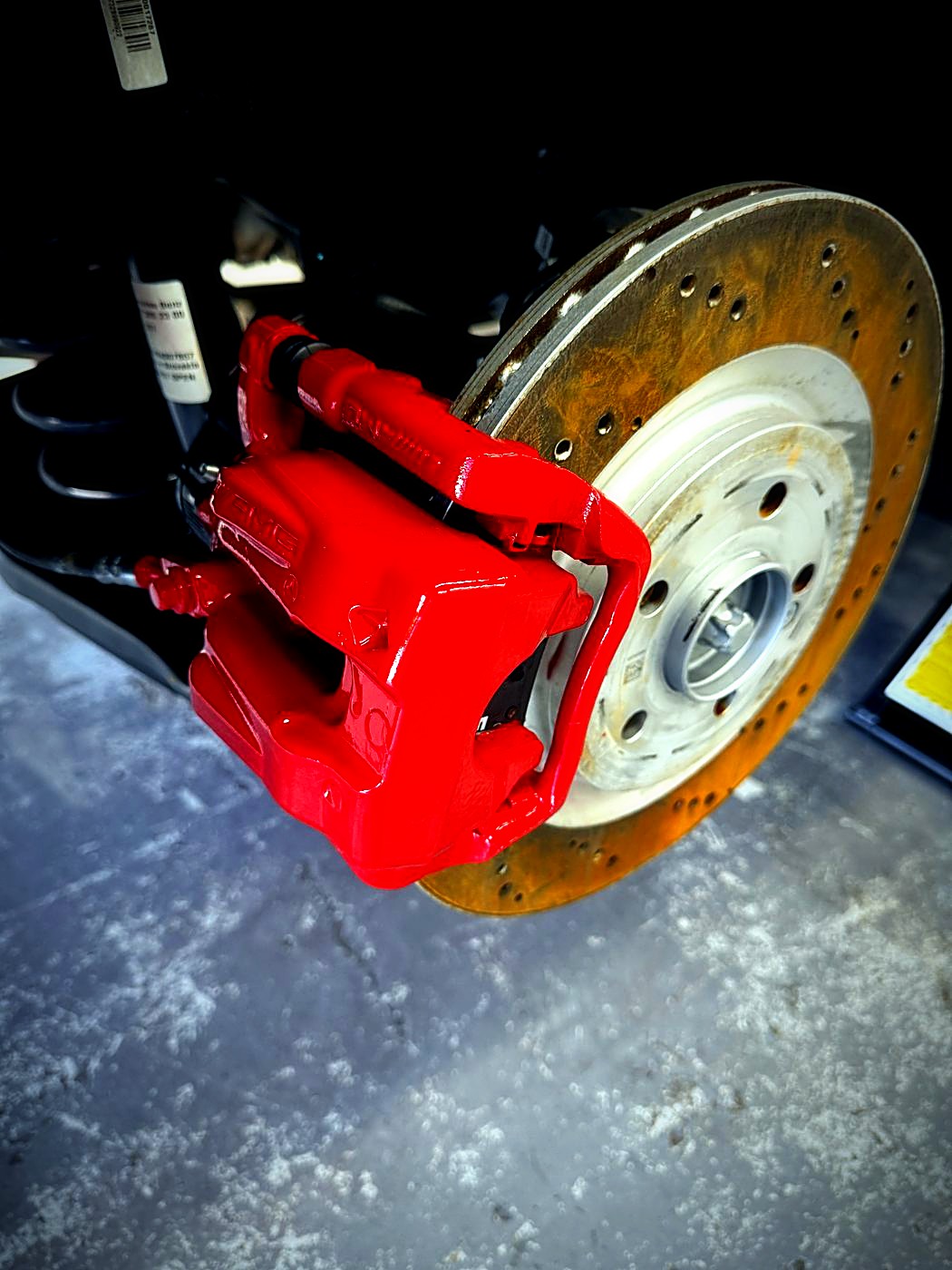 Red caliper with drilled rotor